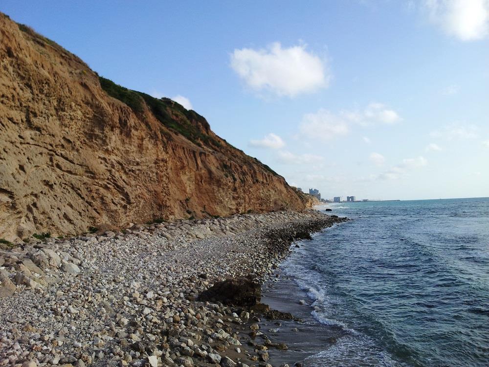 We'll hike south and north along the beach and the cliffs above it, between Yakum and Shfayim.